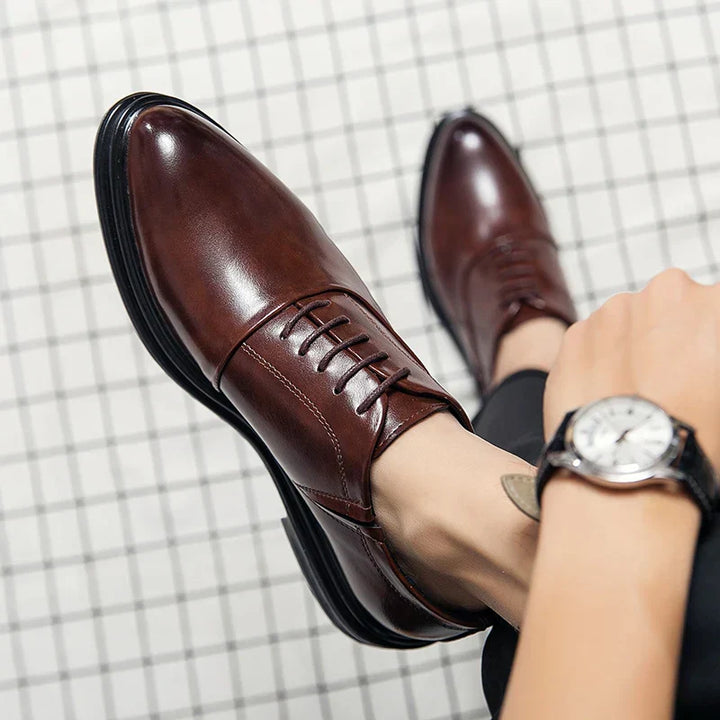 Classic brown men's dress shoes. Versatile formal footwear for gentlemen, ideal for business and elegant occasions.