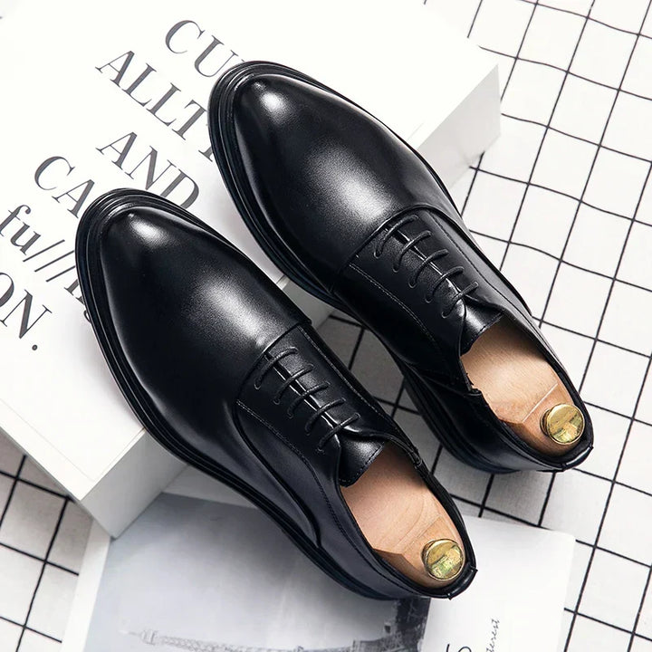 Polished men's formal dress shoes, essential elegant footwear for gentlemen's business attire & special occasions.