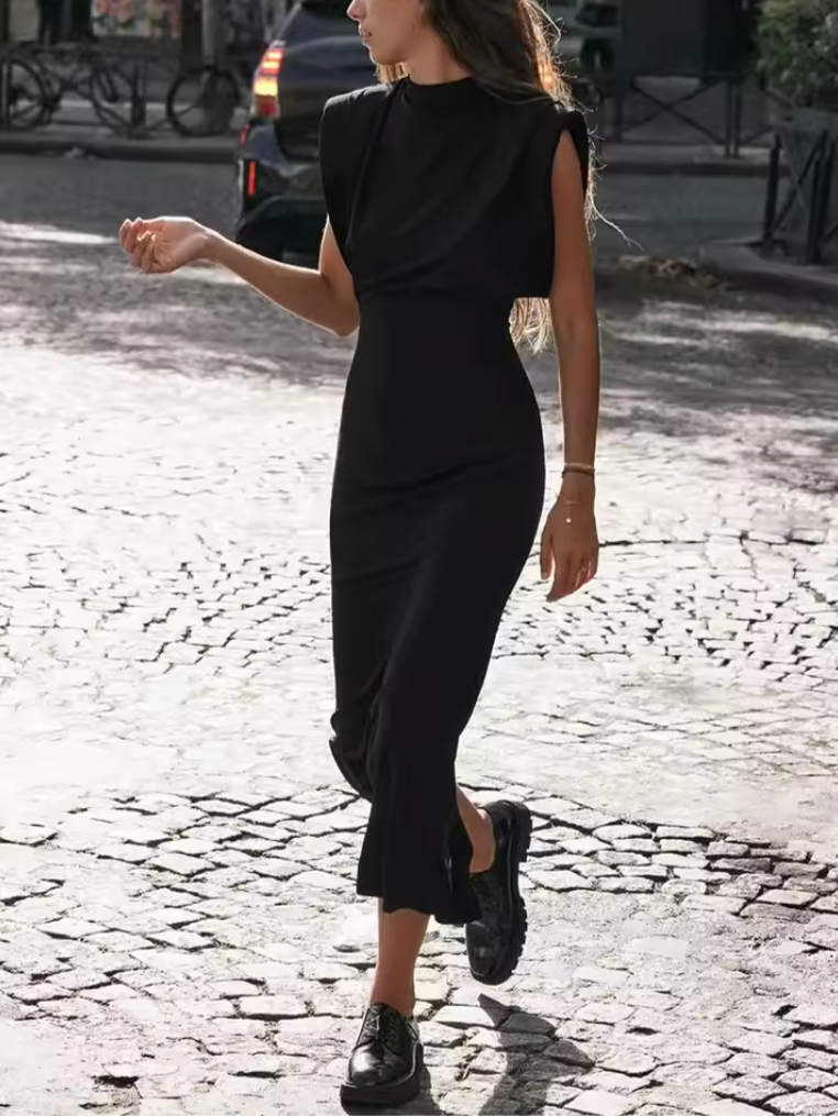 Chic women's black midi dress, ideal for cocktail attire, evening events, or sophisticated daily elegant fashion.