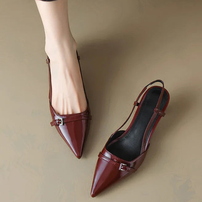 Women's formal black slingback kitten heels with a sleek pointed toe, ideal for elegant office wear.
