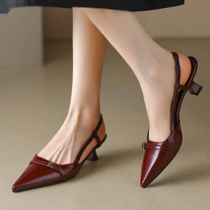 Fashionable pointed toe slingback kitten heels in black, offering women elegance and comfort.
