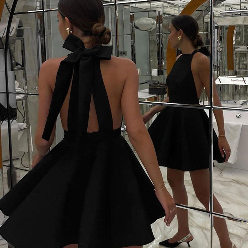 Women's backless satin cocktail dress with an elegant flared skirt, perfect for special events.