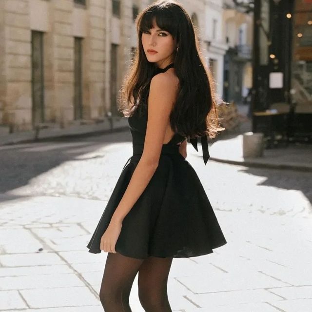 Women's sleeveless A-line cocktail dress in luxurious black satin, ideal for evening wear.