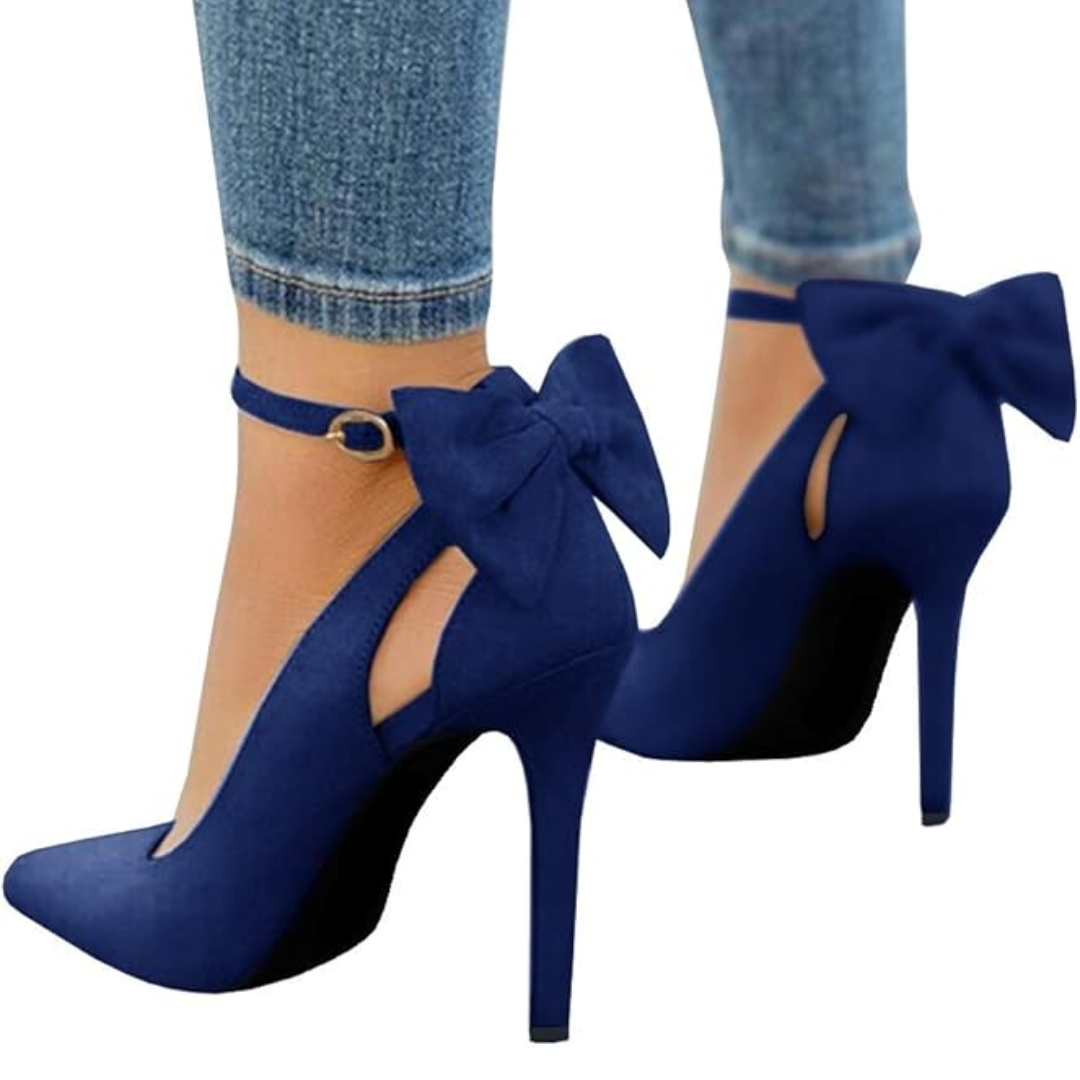 Elegant black stiletto pumps with pointed toe & delicate ankle strap bow, perfect for parties.
