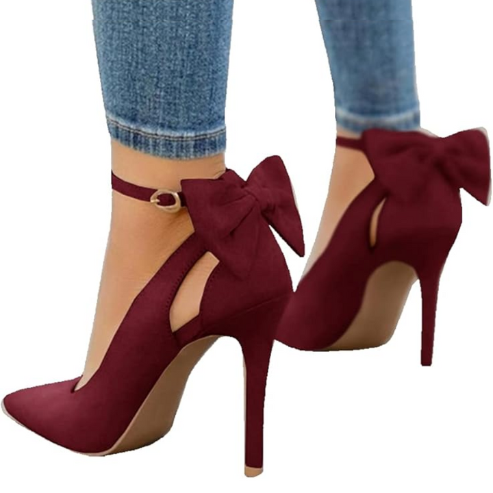 Glamorous women's footwear: pointed toe stiletto pumps with a graceful and feminine bow.