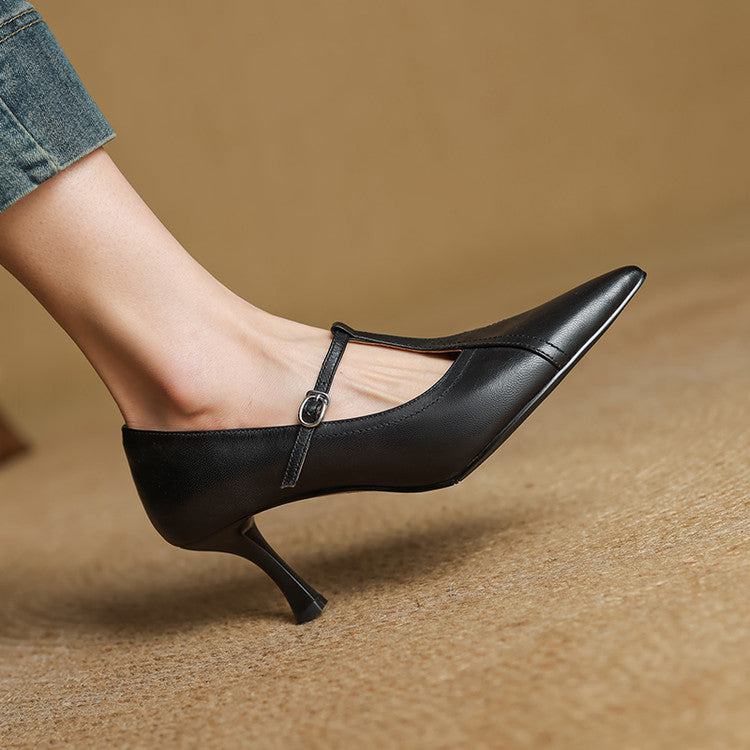 Detail of the elegant T-strap and buckle on women's chic mid-heel formal shoes.