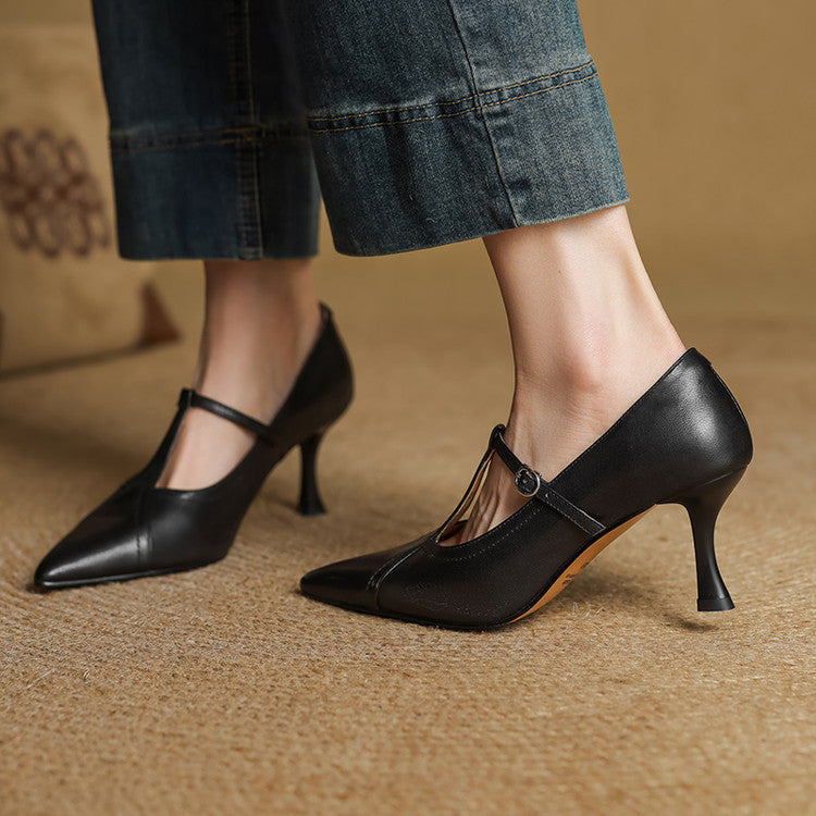 Women's comfortable black mid-heel T-strap shoes, designed for all-day elegance.