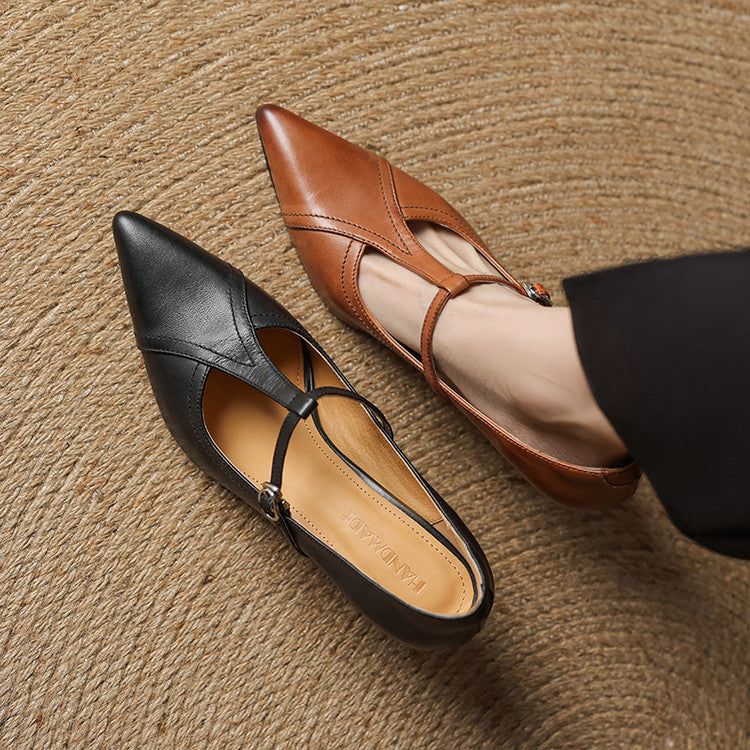 Top view of chic black T-strap mid-heel shoes, highlighting the refined strap details.