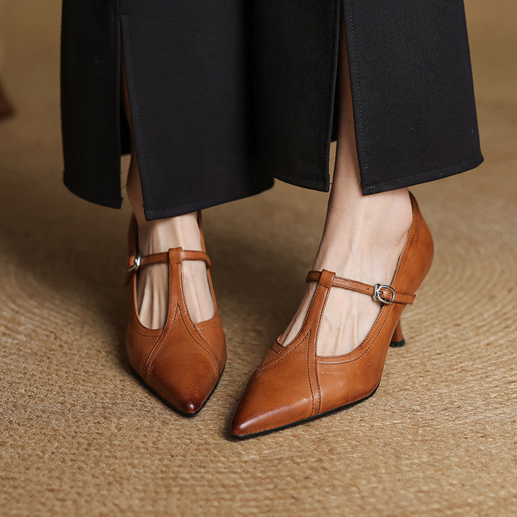 Chic brown T-strap mid-heel shoes with a delicate buckle, ideal for dressy occasions.