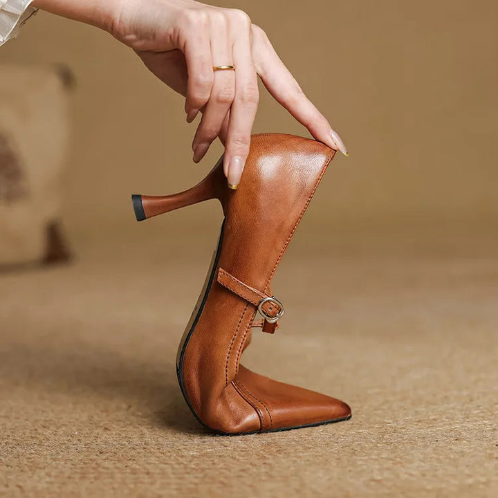 Formal black T-strap heels; elegant mid-heel shoes for sophisticated evening style.