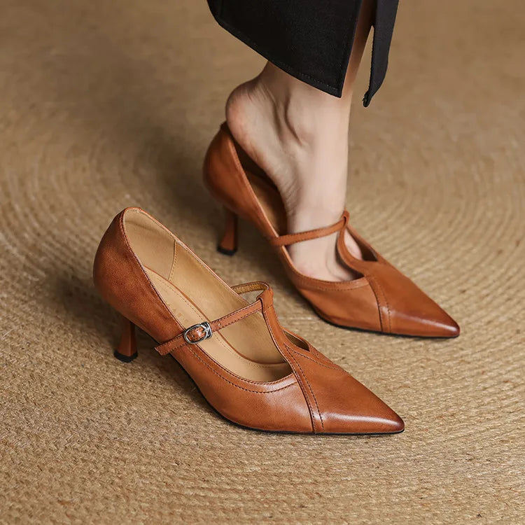Women's elegant black T-strap heels, a versatile classic for any formal ensemble.