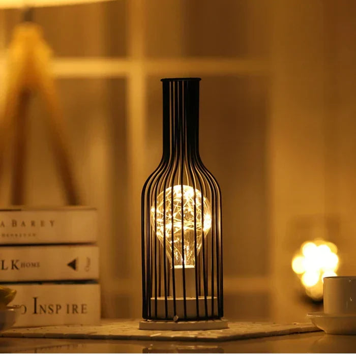 Stylish black table lamp, features a contemporary metal base & fabric shade for modern home decor.