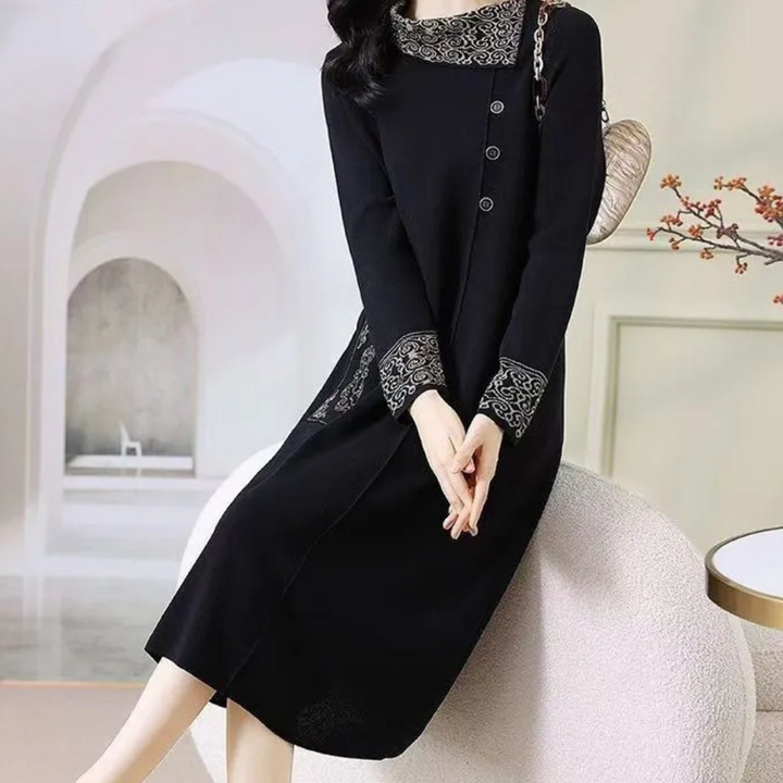 Stylish women's long sleeve black knitted midi dress, offering a flattering and warm winter fit.