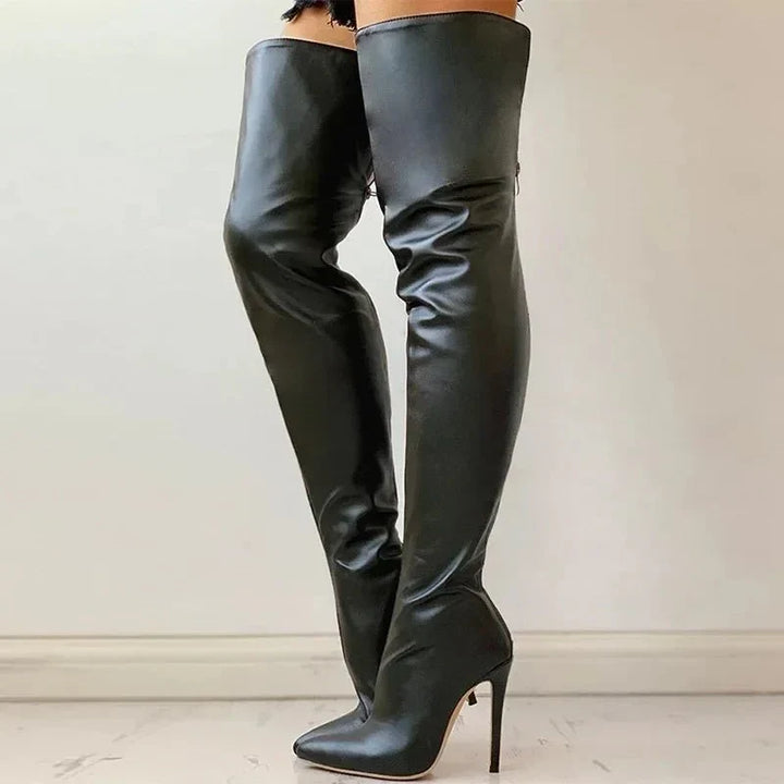 Women's black over-the-knee stiletto boots, offering a pointed toe, slim fit, and elegant evening wear style.