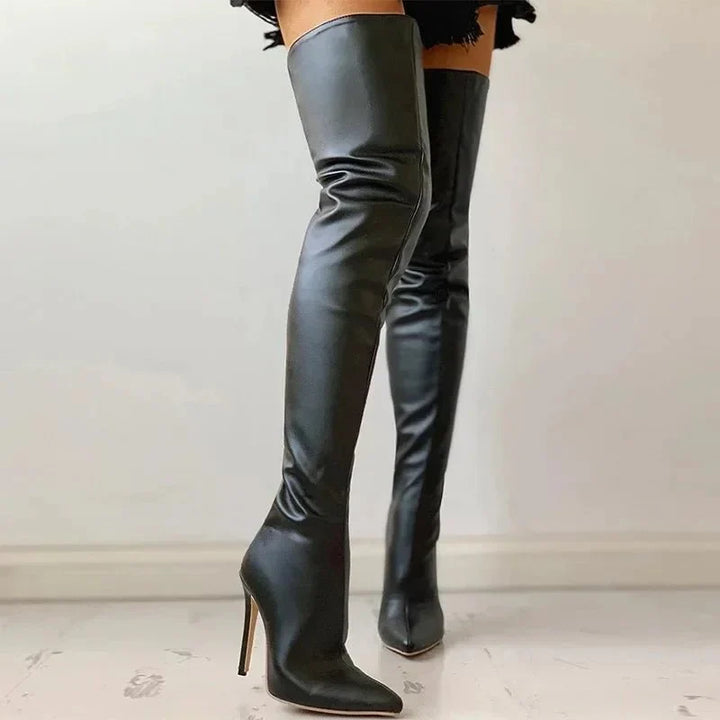 Fashionable tall black over-the-knee boots with a pointed toe and slender stiletto heel, designed for a slim fit.