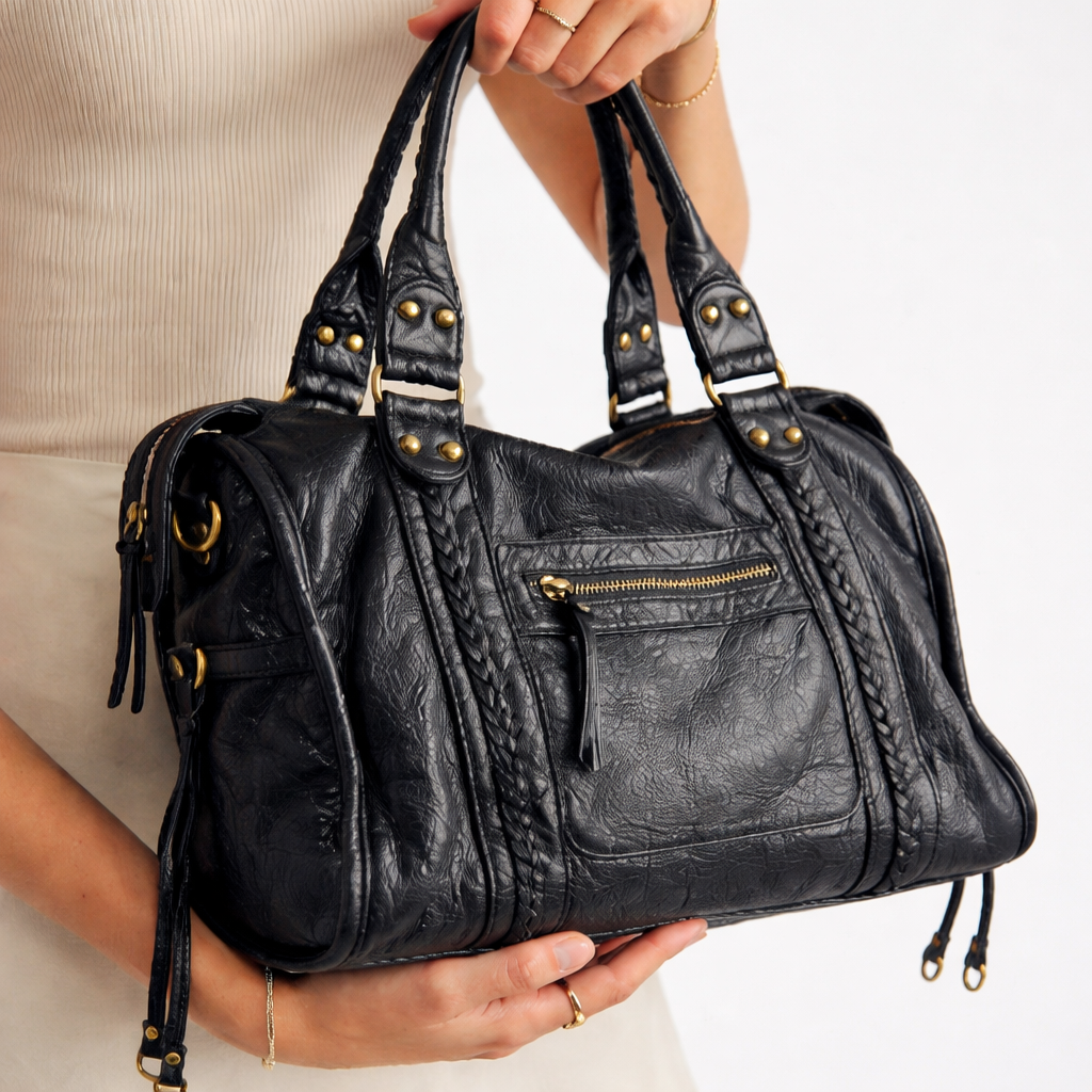 Elegant black women's shoulder bag, versatile for daily carry, spacious and stylish handbag, also functions as crossbody.