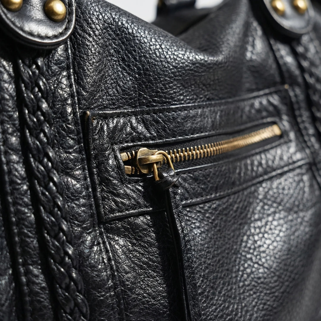 Spacious women's elegant black shoulder bag, also a versatile crossbody for daily use. Fashionable daily carry handbag.