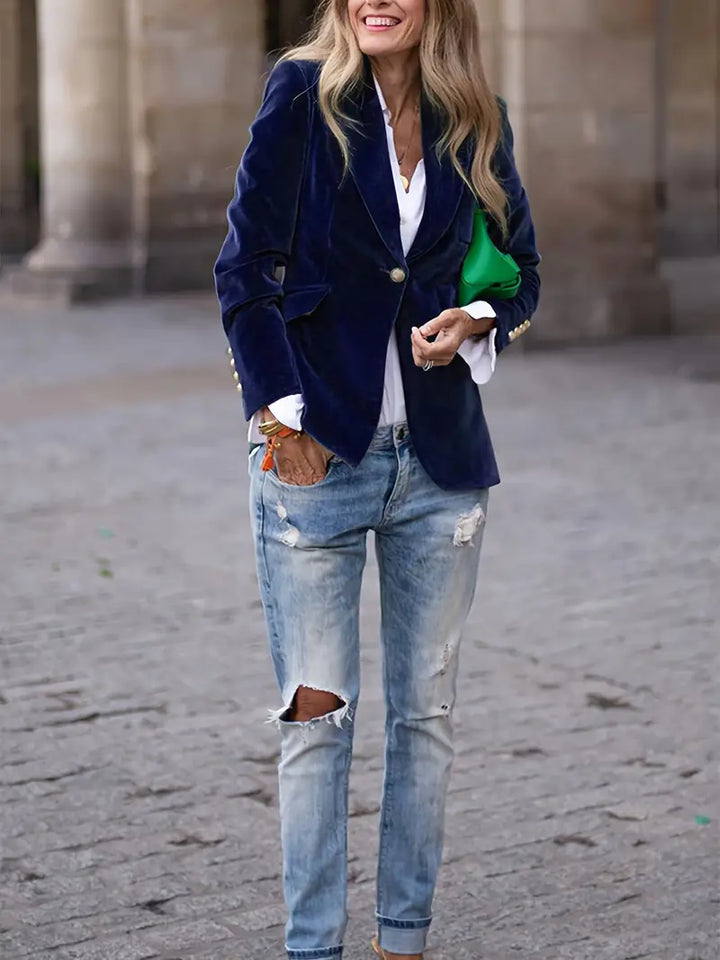 Green tailored women's blazer, slim fit, featuring a sharp peak lapel and stylish gold button accents.