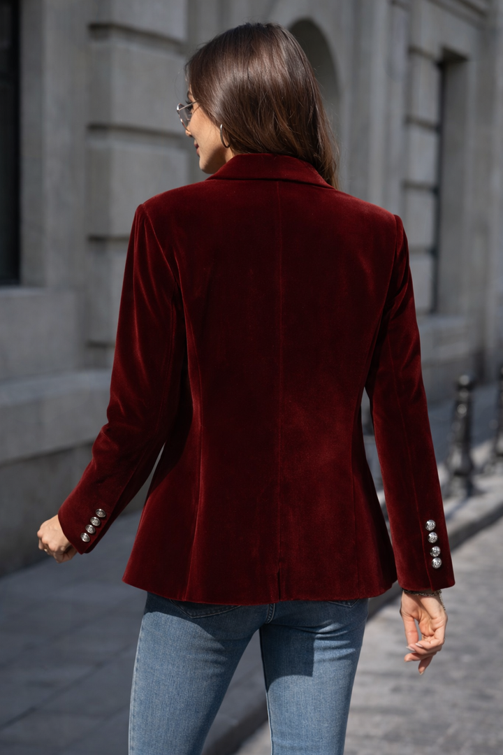 Stylish red women's blazer, tailored slim fit, featuring a sharp peak lapel and elegant gold button accents.