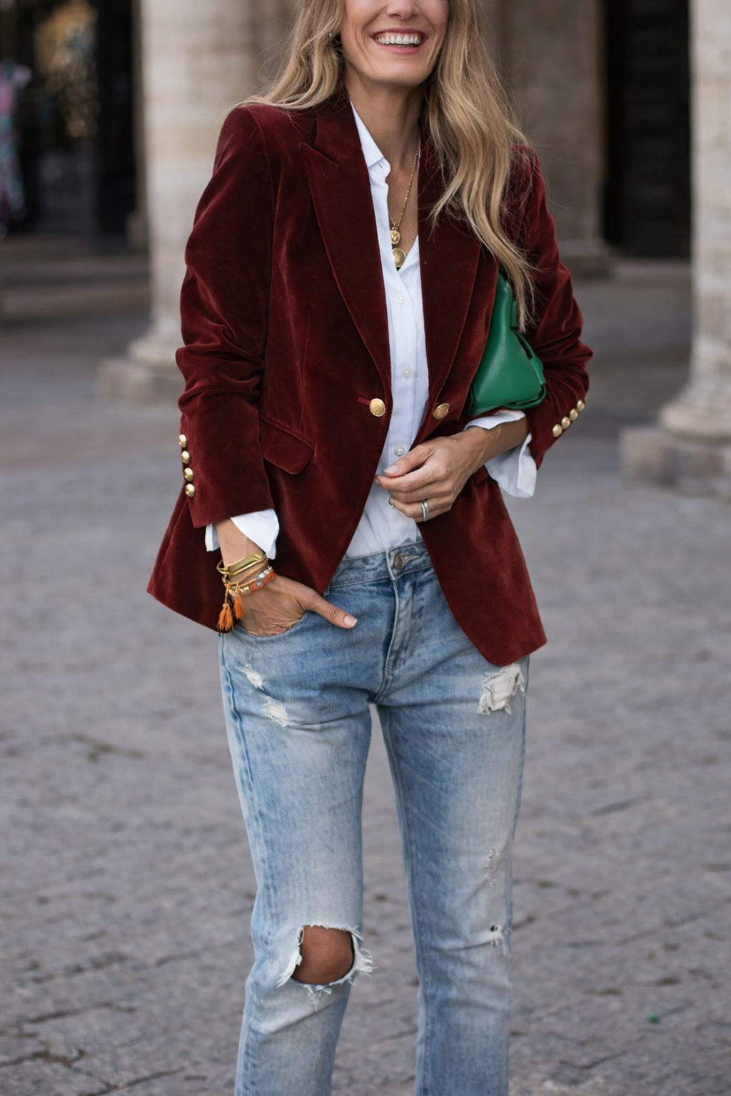 Tailored blue women's formal blazer, slim silhouette, striking peak lapel, and chic gold button detailing.