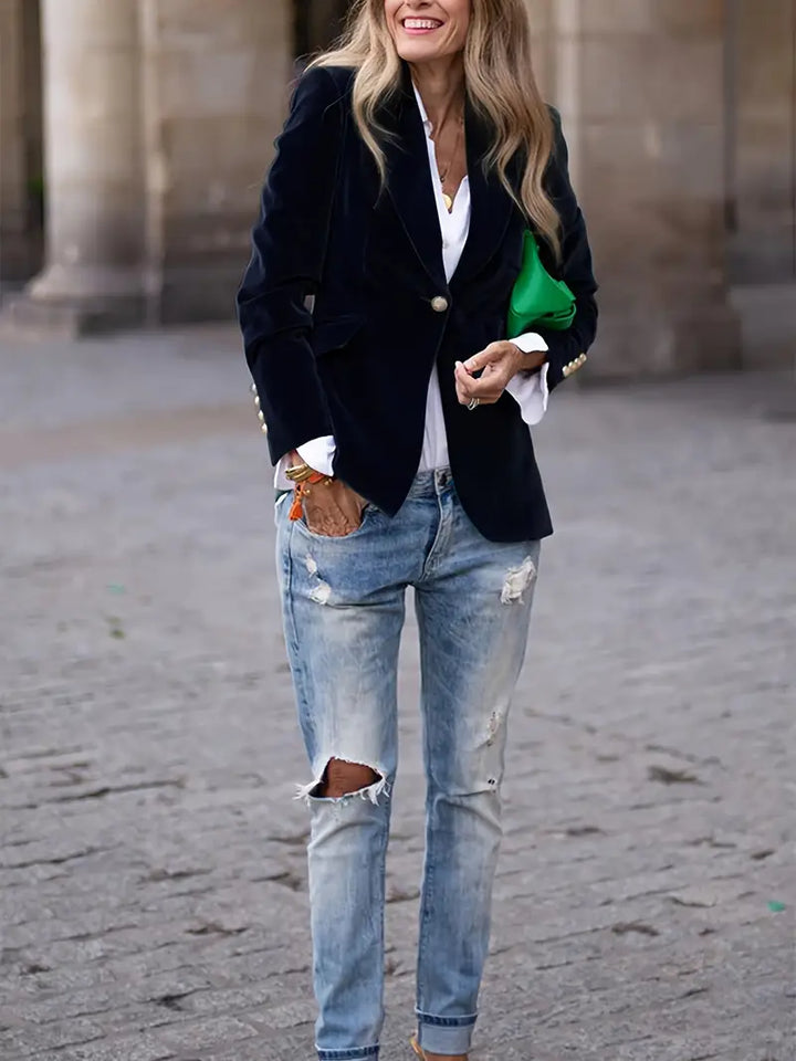 Chic women's slim fit jacket, featuring a peak lapel and gleaming gold buttons, perfect for elegant wear.