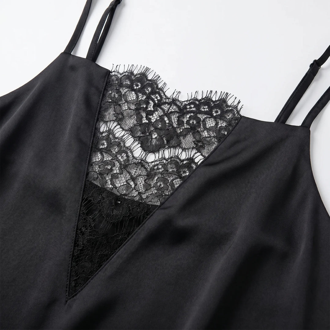 Chic black mini slip dress for women, featuring intricate lace trim and delicate spaghetti straps, ideal for summer evenings.