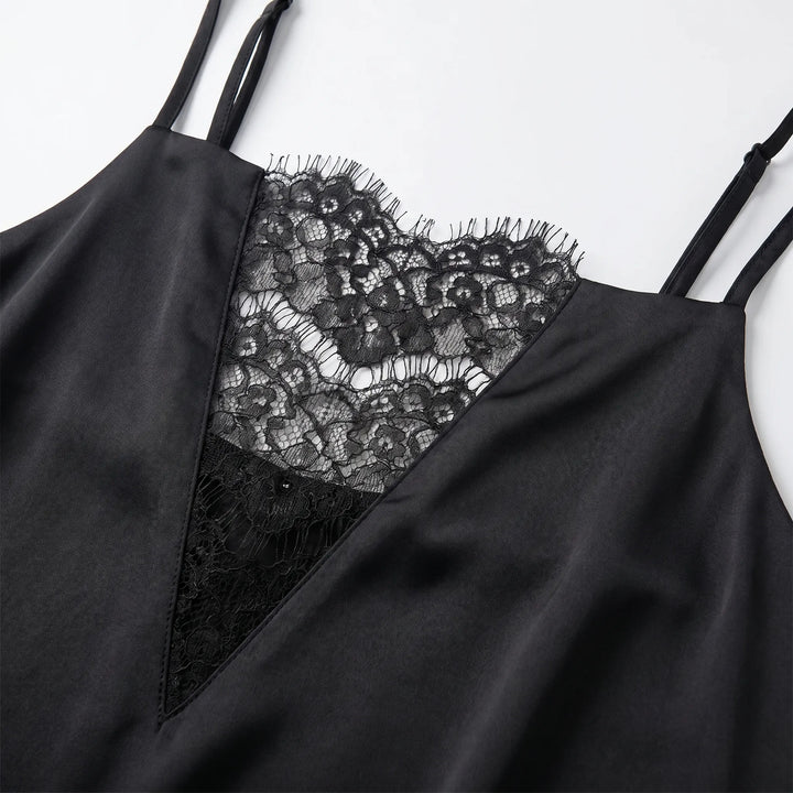 Chic black mini slip dress for women, featuring intricate lace trim and delicate spaghetti straps, ideal for summer evenings.
