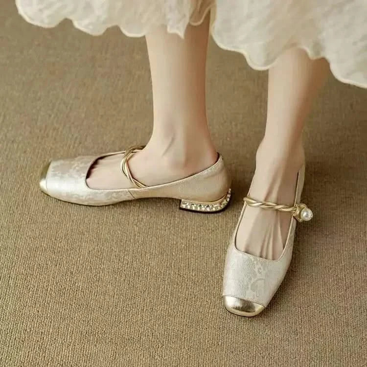 Designer women's square toe pumps featuring an exquisite studded heel, offering both style and elegance.