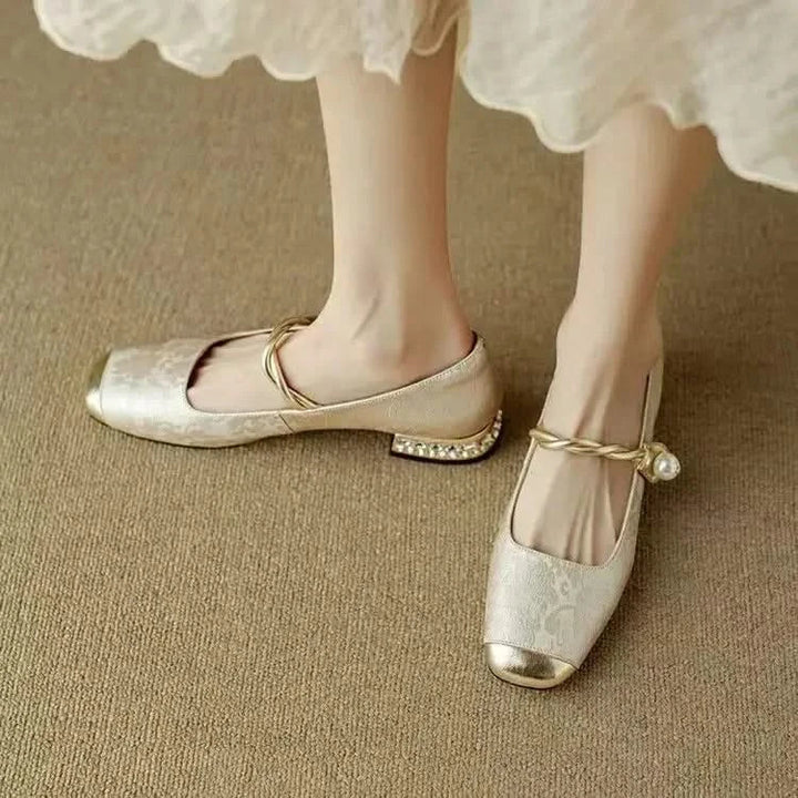 Designer women's square toe pumps featuring an exquisite studded heel, offering both style and elegance.