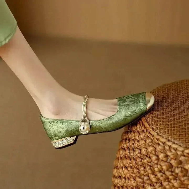Stylish women's square toe pumps featuring a unique studded heel, ideal fashion footwear for parties & events.