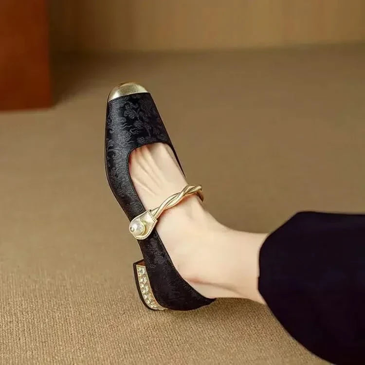 Fashionable women's dress shoes: black square toe pumps with a striking studded heel, versatile for occasions.