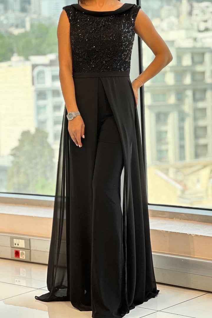 Elegant black women's textured crew neck jumpsuit, versatile for modern casual or formal fashion.