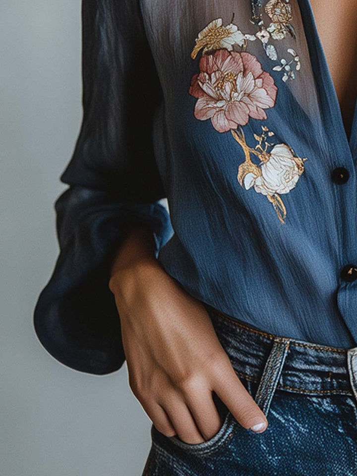 Stylish women's blue V-neck top with beautiful floral embroidery and trendy sheer long sleeves.
