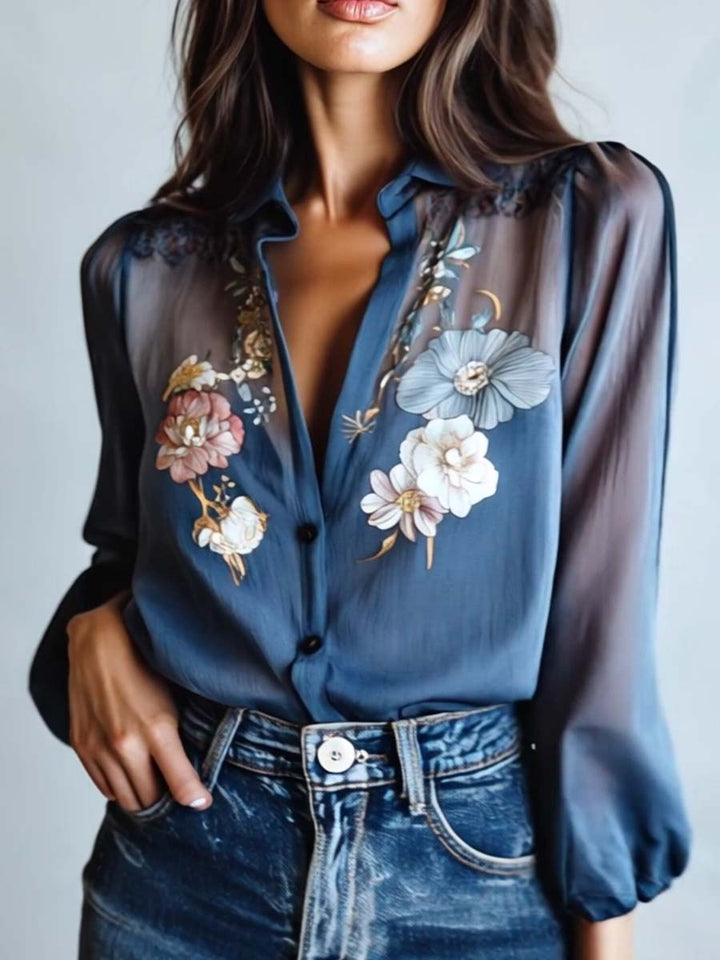 Blue floral embroidered blouse with sheer sleeves and V-neck, an elegant long-sleeve top for women.