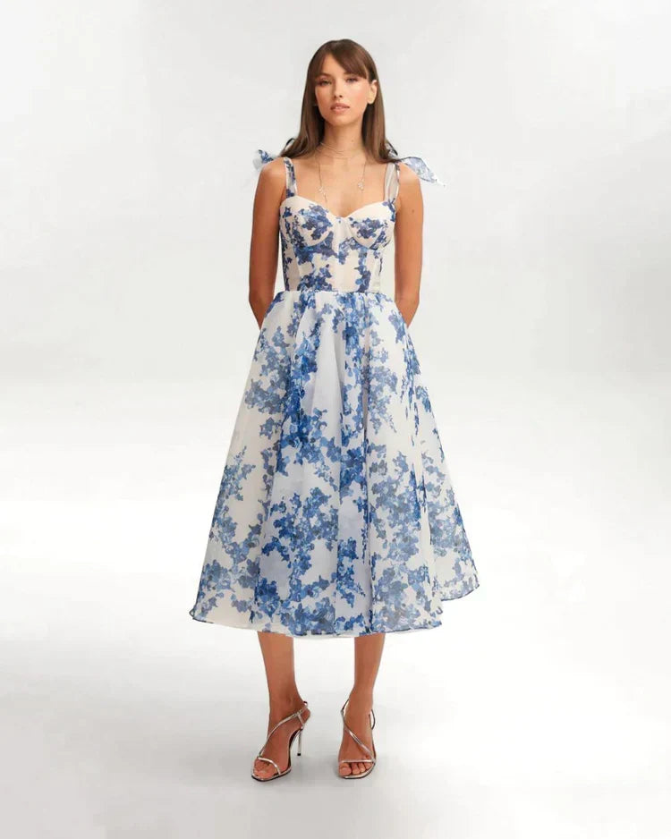 Elegant blue floral midi dress for women, sweetheart neckline, tie straps, corset back, flared skirt. Perfect for parties.