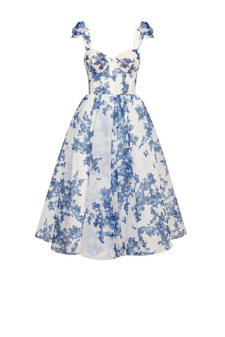 Women's blue floral midi dress with tie straps, sweetheart neckline, and a flowing flared skirt. Perfect for elegant events.