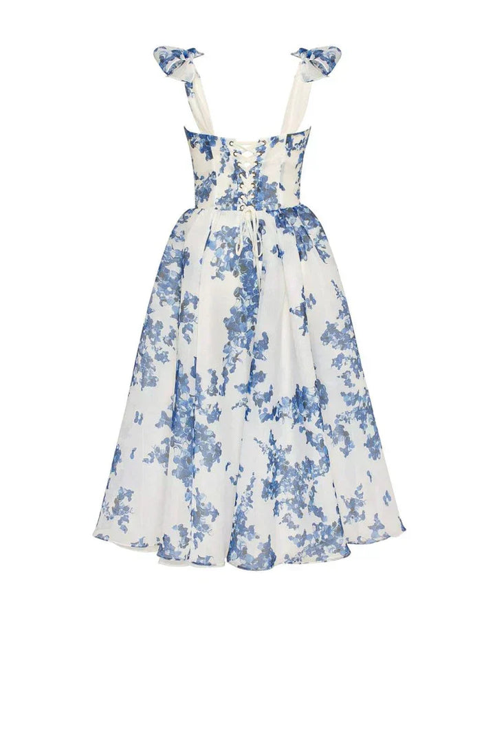 Chic blue floral midi dress with sweetheart neckline, corset back & tie straps. A beautiful choice for summer parties.