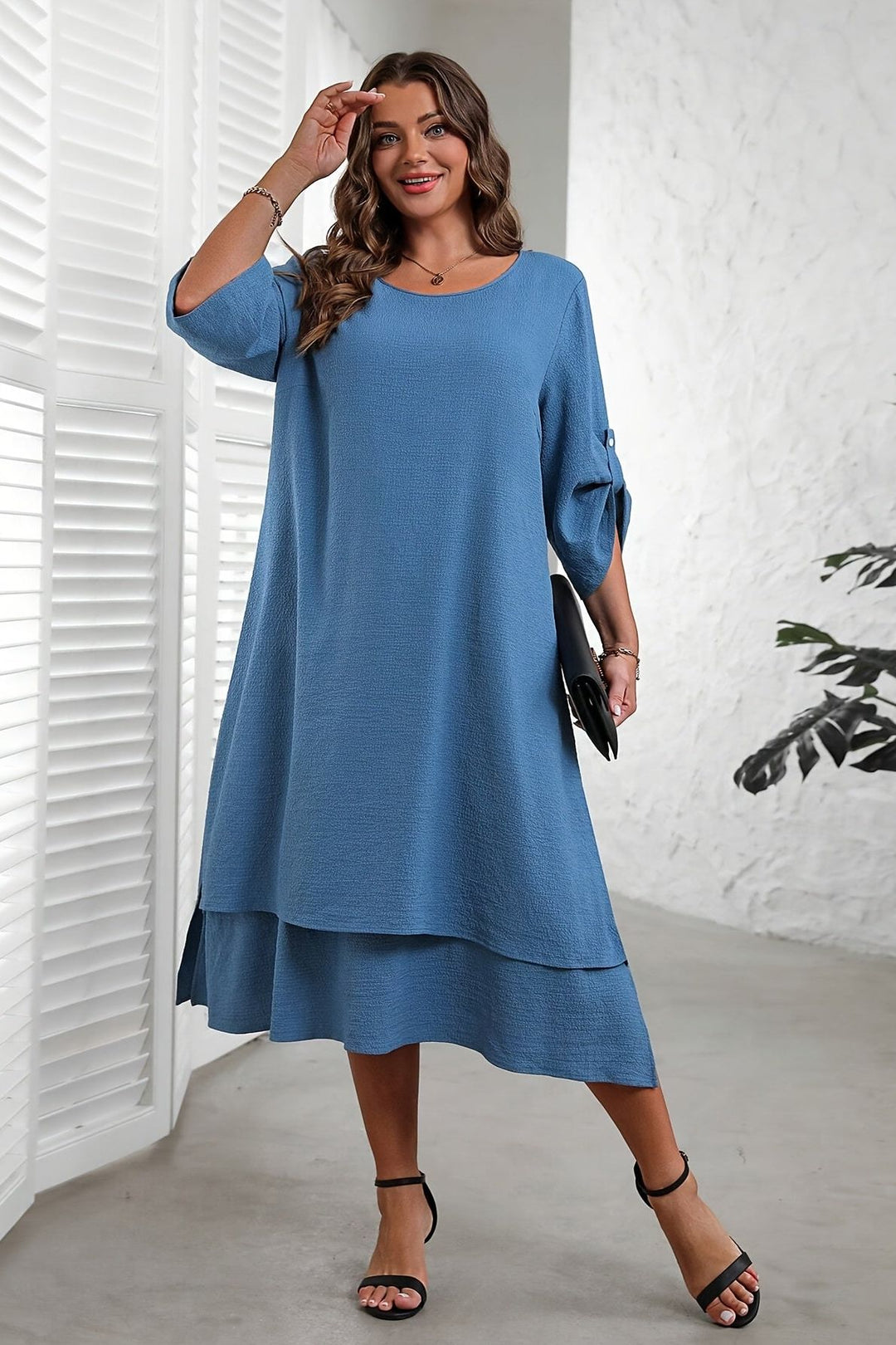 Elegant blue flowing midi dress for women, perfect for versatile day-to-night style and comfortable wear.