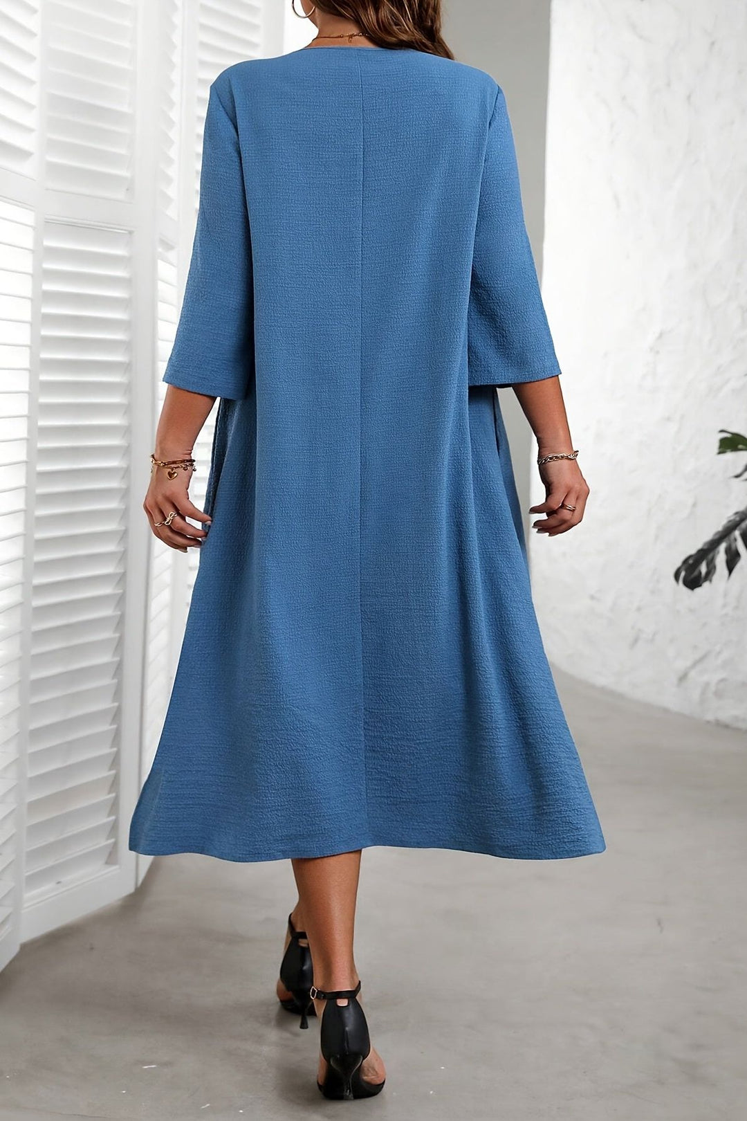Women's comfortable flowing blue midi dress, ideal for office wear, casual spring fashion, or elegant summer events.