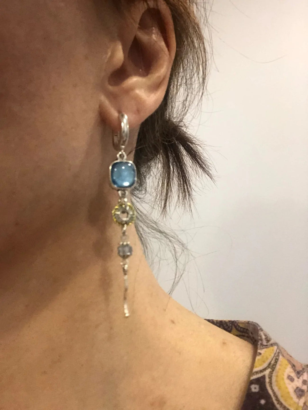 Exquisite blue stone cross drop earrings for women, an elegant spiritual accessory & timeless fashion statement.