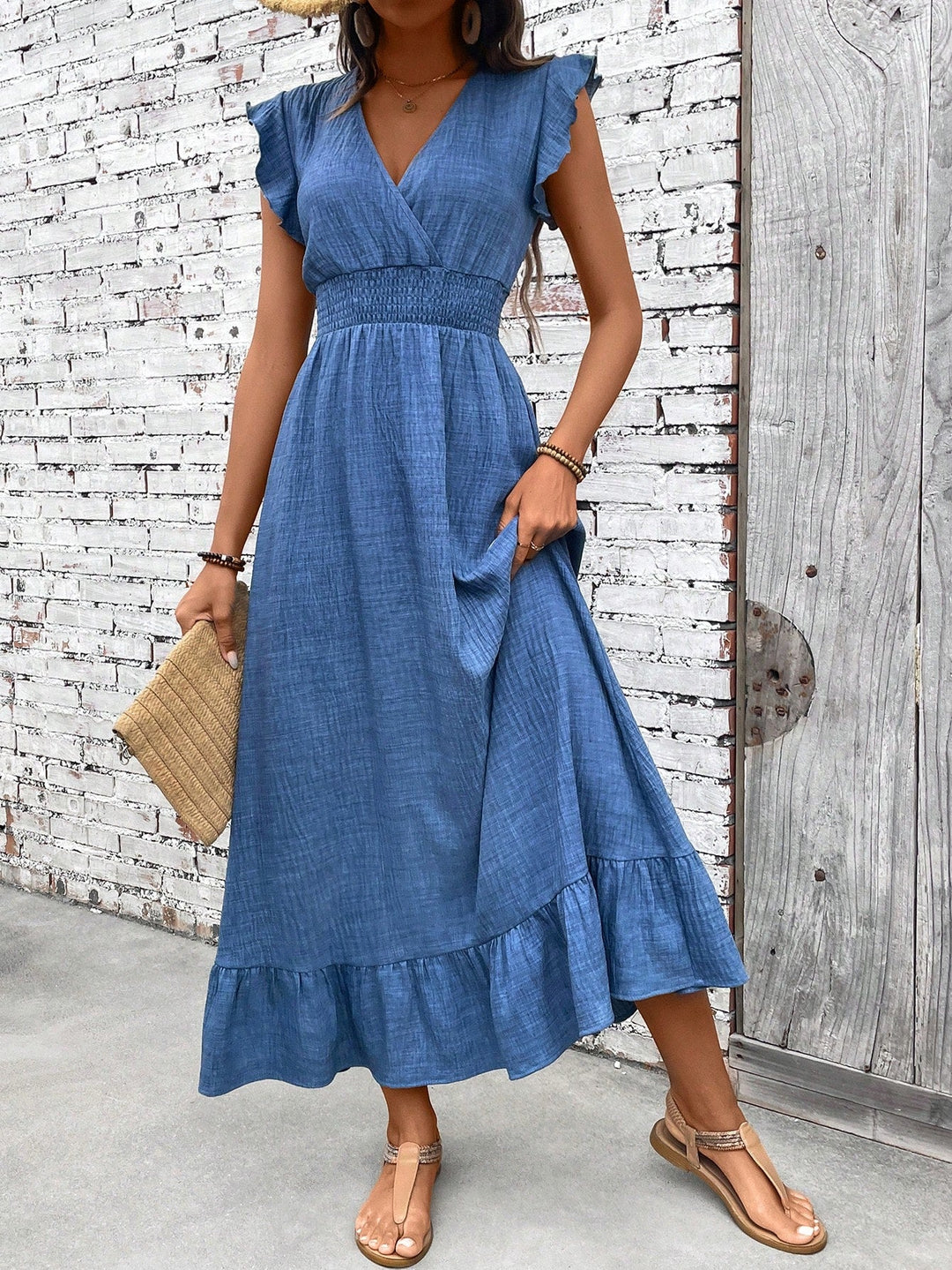Elegant blue women's V-neck smocked waist ruffle maxi dress, flowy boho chic for summer casual wear.