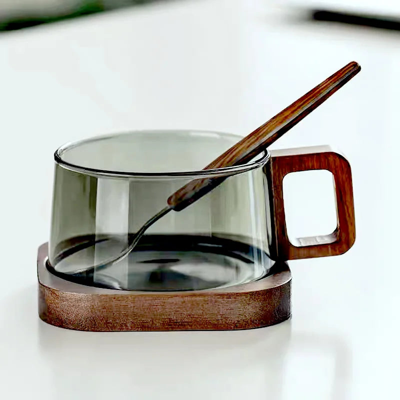 Elegant borosilicate glass mug with a stylish cedar wood handle, perfect for coffee, tea, and hot drinks.