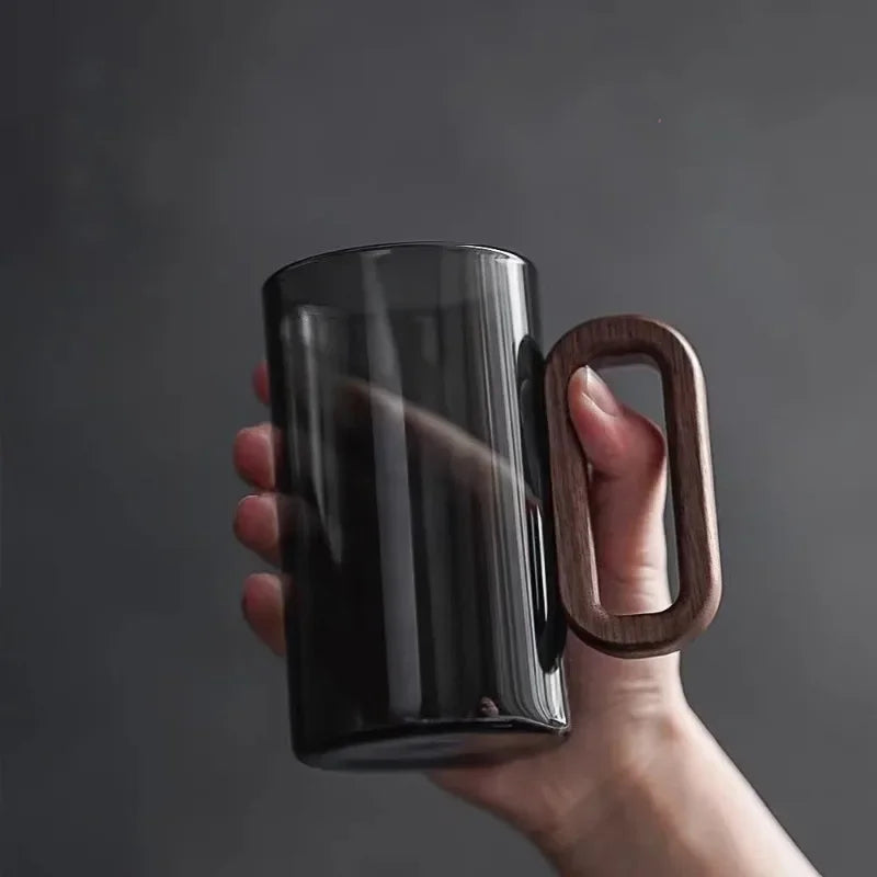 Unique glass mug featuring a natural walnut handle, ideal for home decor, coffee, or as an elegant gift.