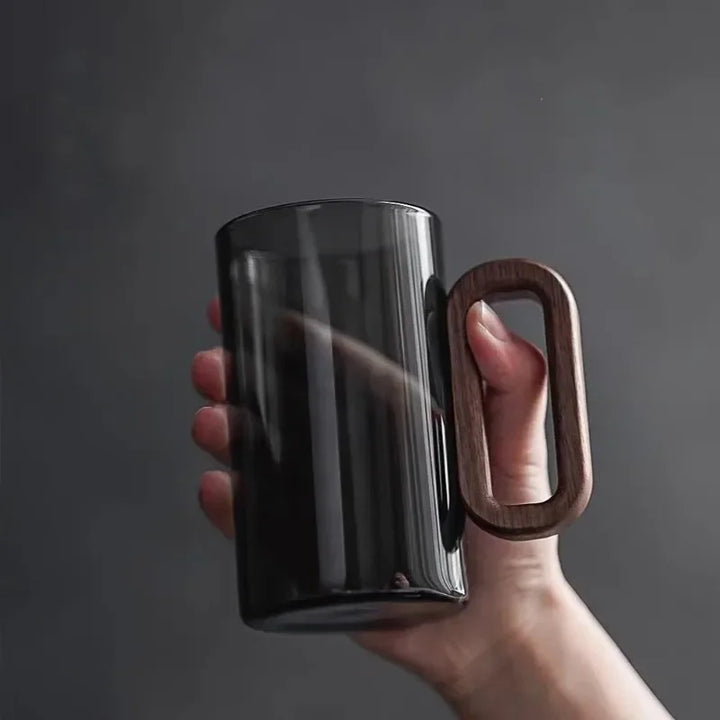 Unique glass mug featuring a natural walnut handle, ideal for home decor, coffee, or as an elegant gift.