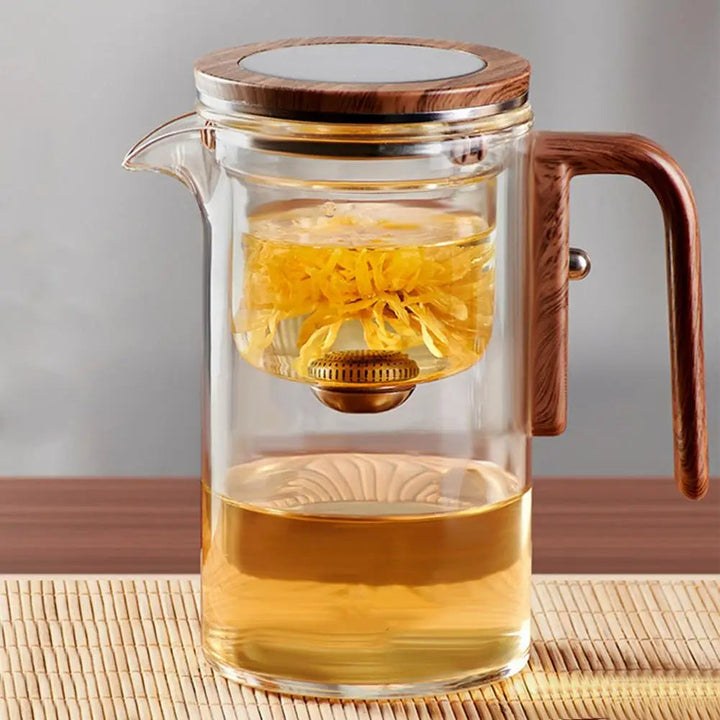 Elegant borosilicate glass teapot with stainless steel infuser for loose leaf tea. Perfect kitchenware gift.