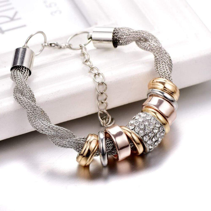 Fashionable braided rose gold bracelet for women, modern jewelry piece
