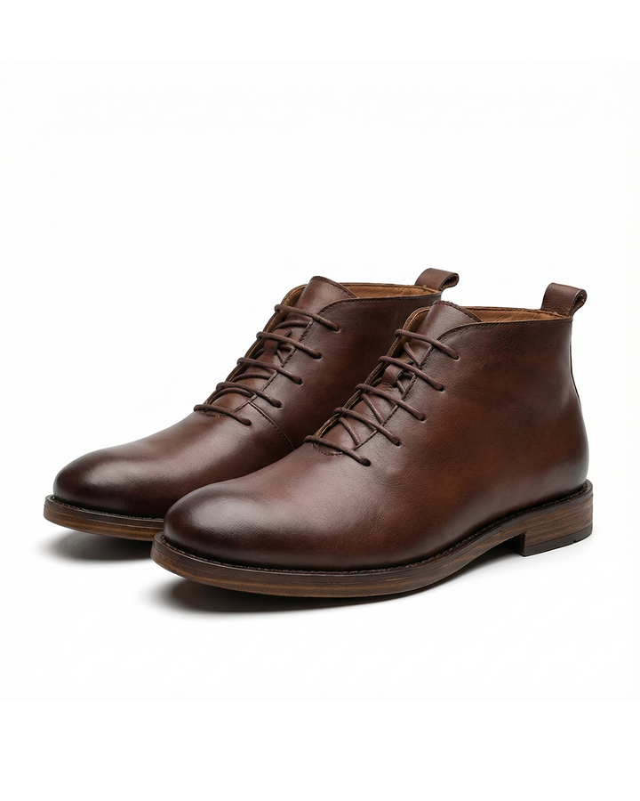 Elegant brown leather dress boots for men. Versatile, comfortable men's footwear, perfect for formal or casual wear.