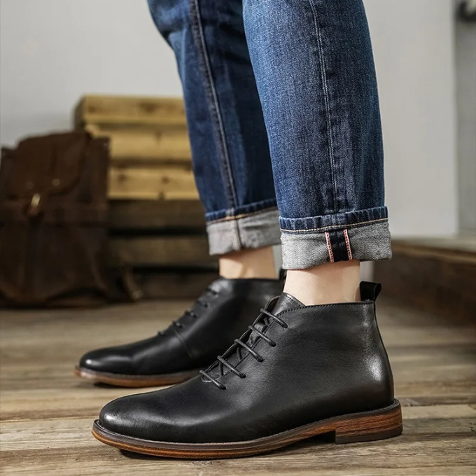 Front view of elegant brown leather men's boots. Classic design for formal or smart casual events. Comfortable footwear.