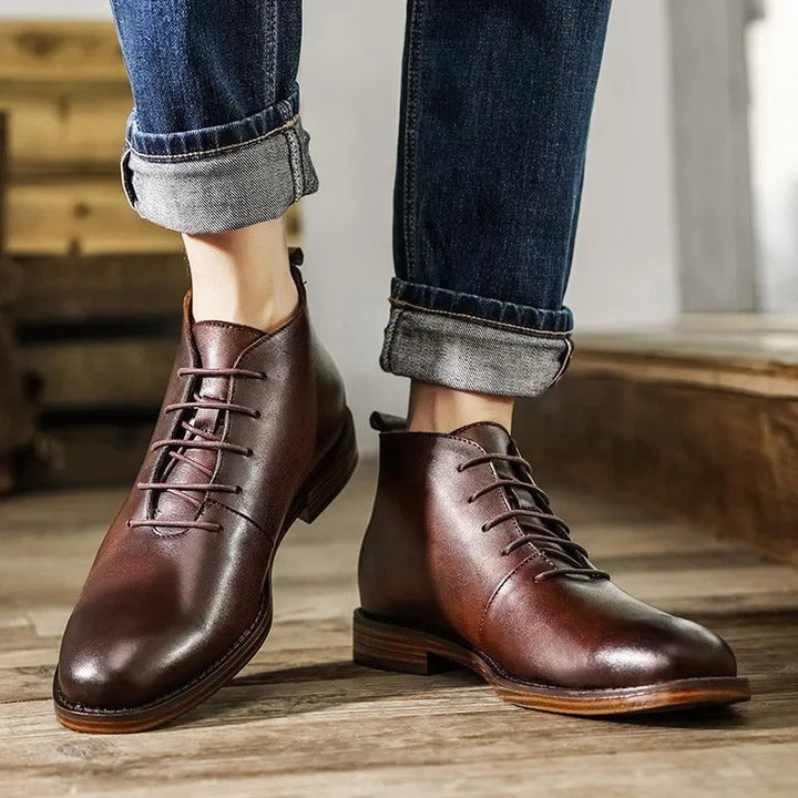 Close-up of premium brown leather men's boot, showcasing rich texture & quality craftsmanship. Versatile dress footwear.