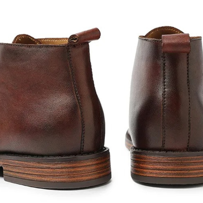 Casual brown leather men's ankle boots on-foot, paired with jeans. Comfortable & durable everyday footwear.